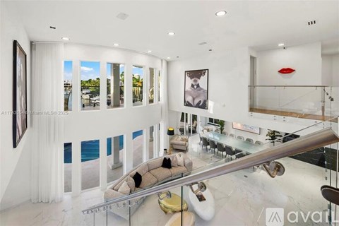 A modern living room with a glass table and a sofa.