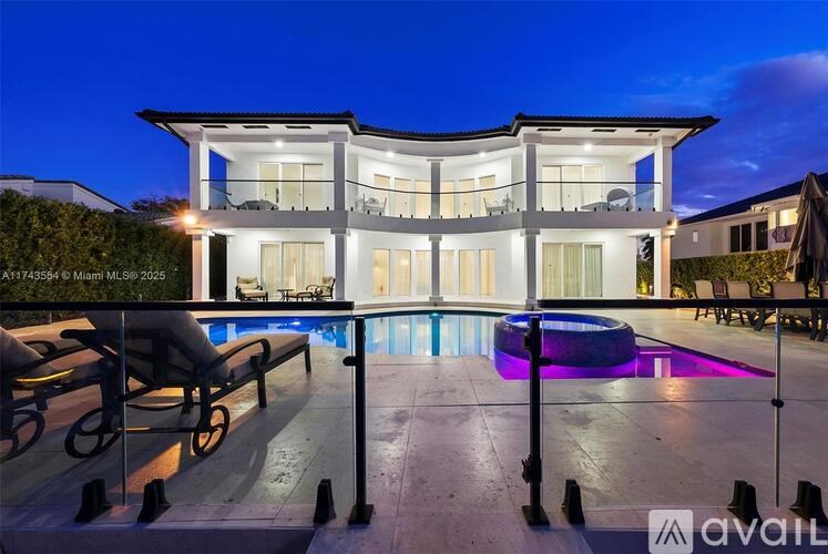 A modern house with a pool in the backyard.