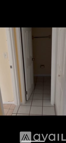 A hallway with a door at the end.