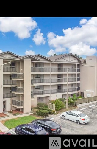 A car is parked in front of a building with the word "available" on it.