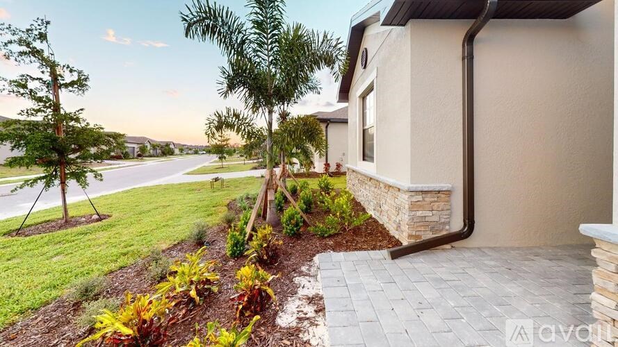 A house with a well-maintained garden in front.