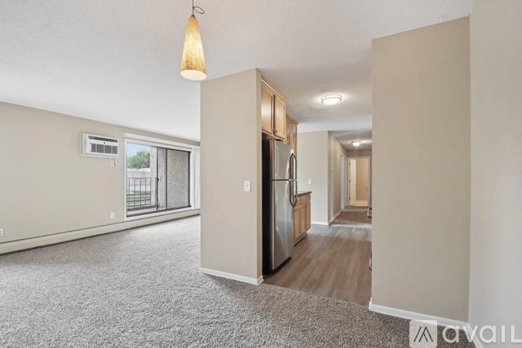 A kitchen area with a refrigerator, microwave, and oven.