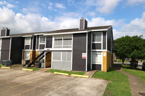 A small building with a sign on it.