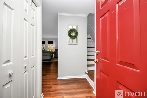 A red door is on the right side of the image.