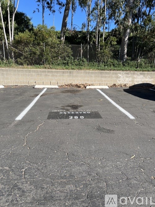 A parking lot with a sign that says "Reserved 289".