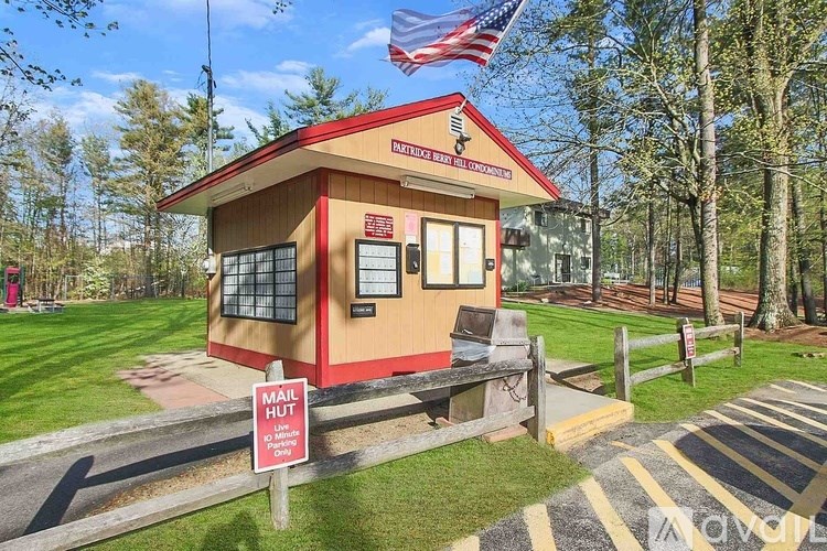 A small building with a sign that says "Mail Drop" in front of it.