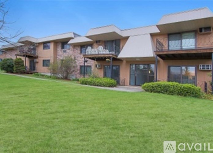 A building with a lawn in front of it.