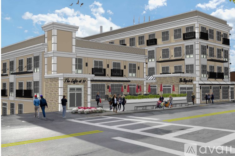 A street view of a building with people walking and a sign that says "The life at".