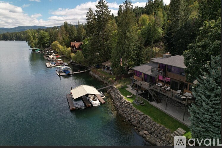 A serene lakefront property with a dock and boats.