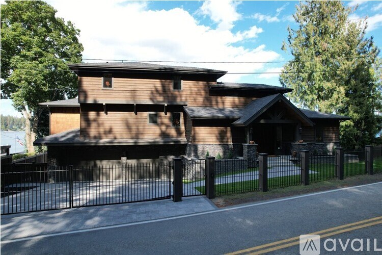 A house with a black fence in front of it.