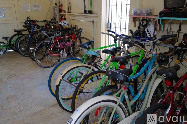 A room full of bicycles of various colors and sizes.