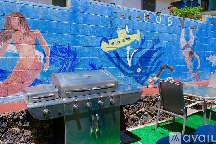 A mural of a woman and a fish painted on a wall.