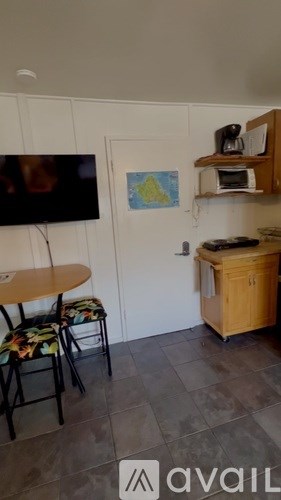 A small kitchen with a table and chairs.