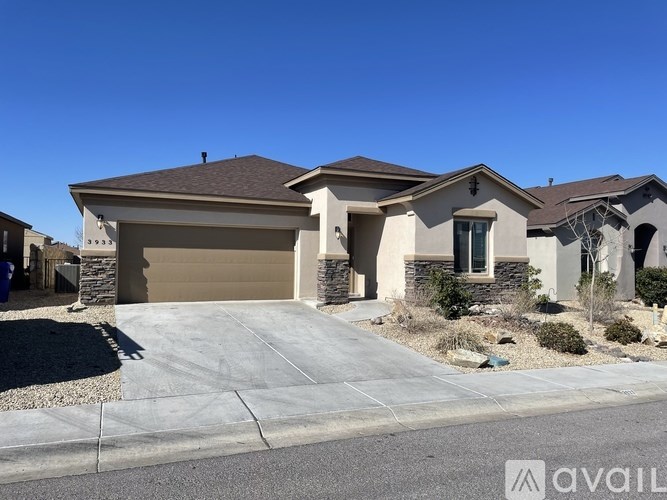 A house with a garage is available for sale.