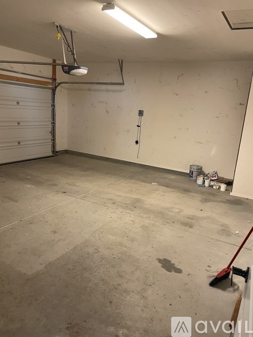 A room with a white wall and a white door.