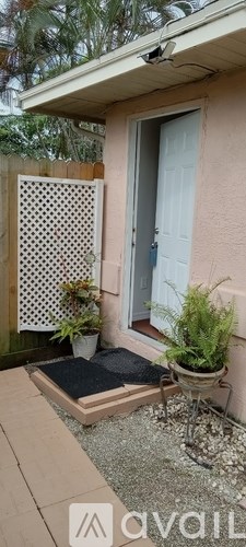 A small patio with a table and chairs.