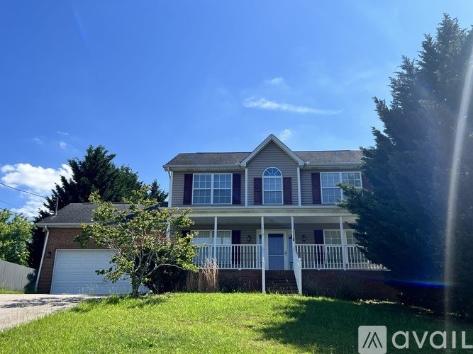 A house with a blue sky in the background.