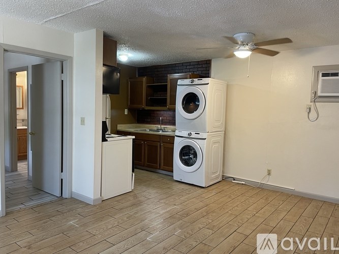 A room with a washer and dryer in it.