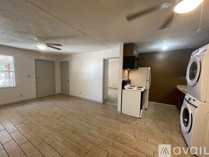 A room with a washer and dryer set up.