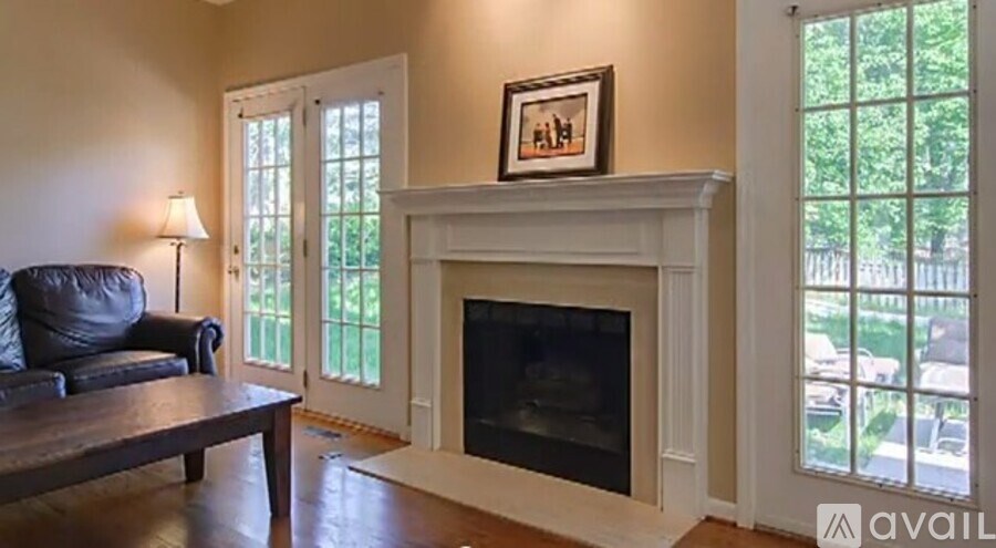 A living room with a fireplace and a couch.