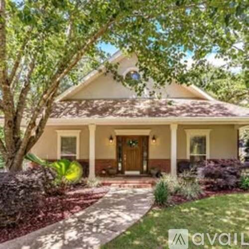 A house with a brown door and a front porch.