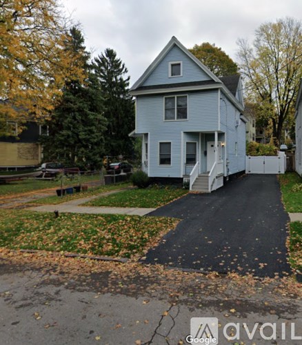 A house with a driveway in front of it.