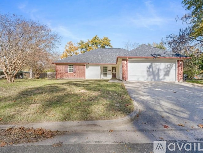 A house with a garage is for sale.