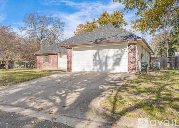 A house with a garage is available for sale.