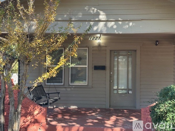 A house numbered 221 is shown with a tree in front.