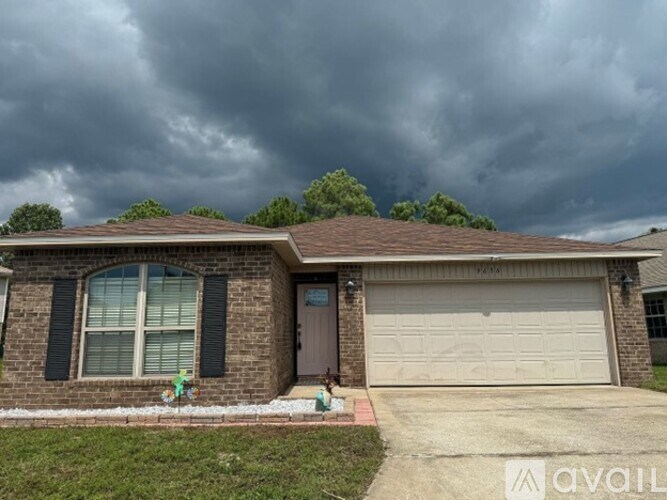 A house with a brown garage door and a grey driveway.