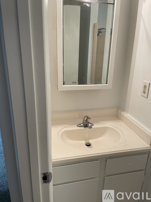 A bathroom sink with a mirror above it.