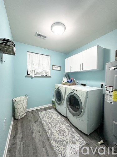 A laundry room with a washer and dryer.