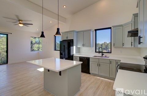 A kitchen with a large island in the middle of the room.