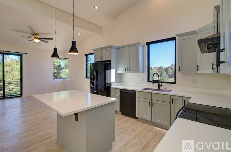 A modern kitchen with a large island in the middle.