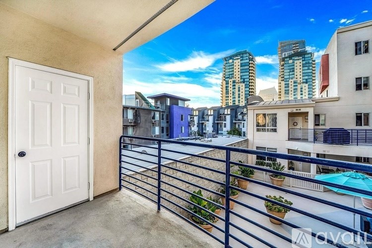 A balcony with a white door and a pool table.