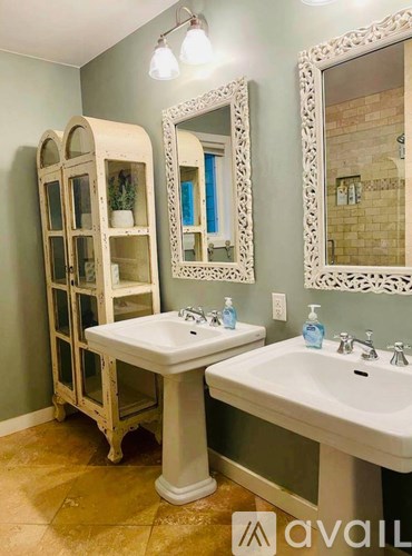 A bathroom with a sink and a mirror.