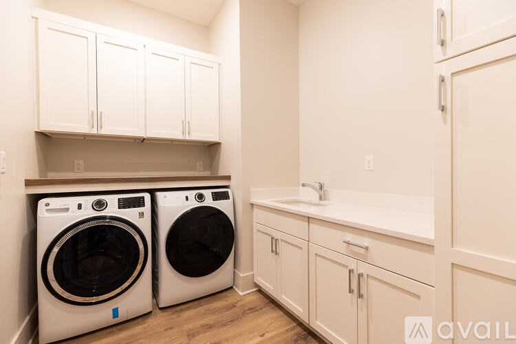A laundry room with a washer and dryer.