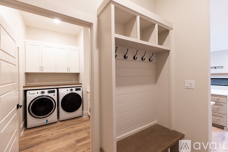 A laundry room with a washer and dryer in it.