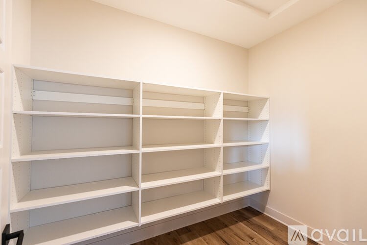 Empty white shelves in a room.