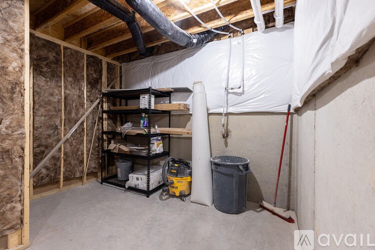 A room under construction with a white tarp covering the ceiling.