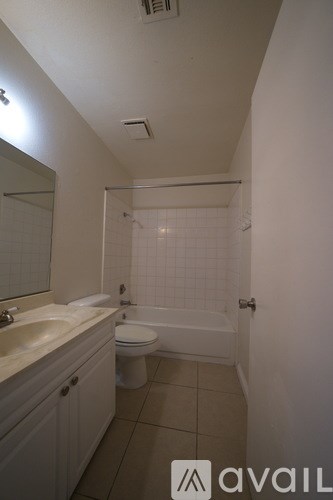 A bathroom with a sink, toilet and bathtub.