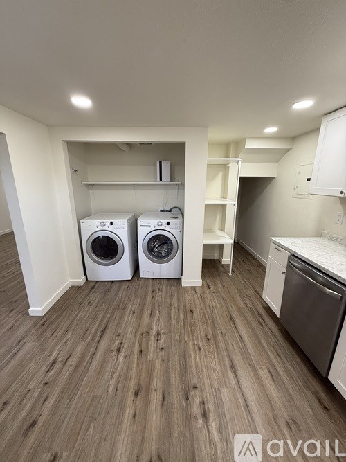 A laundry room with a washer and dryer.