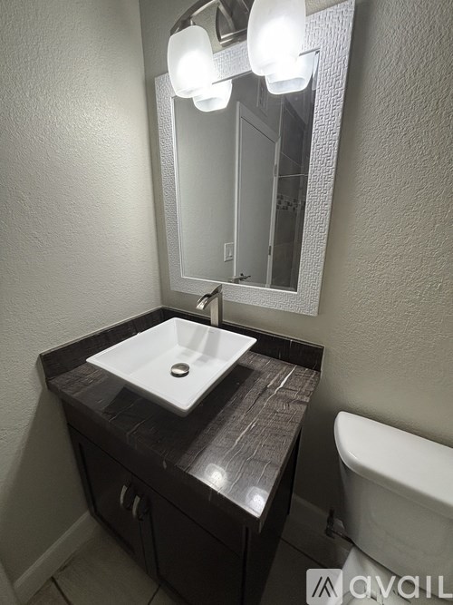 A bathroom sink with a mirror above it.