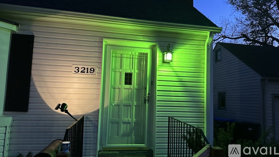 A house numbered 3219 is shown with a green light on.