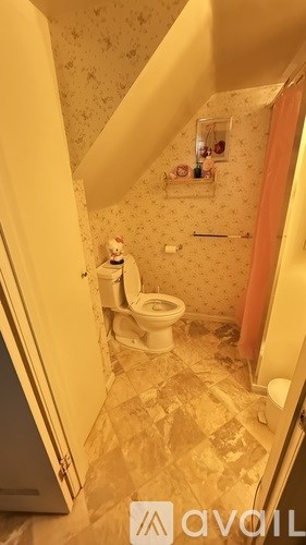 A bathroom with a toilet and a sink.