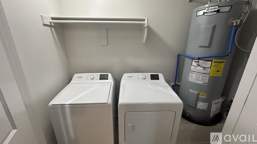 A laundry room with a washer and dryer.