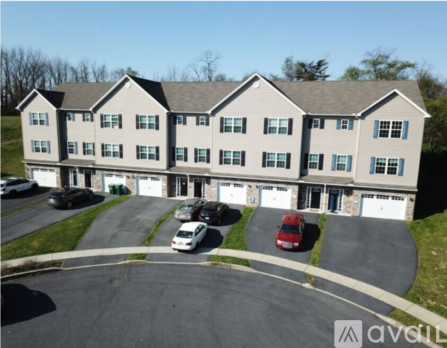 A large building with a parking lot in front of it.