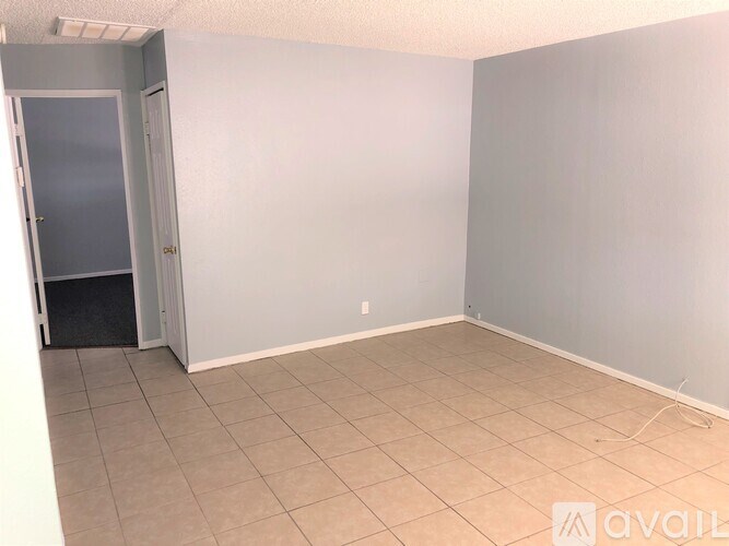 A room with a door and a wall.