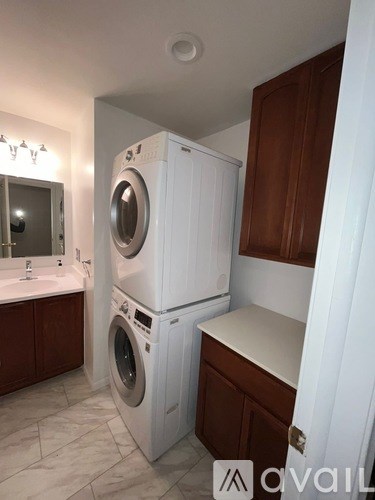 A white washer and dryer in a small laundry room.