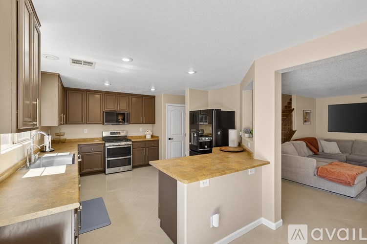 A spacious kitchen with a large island in the middle.